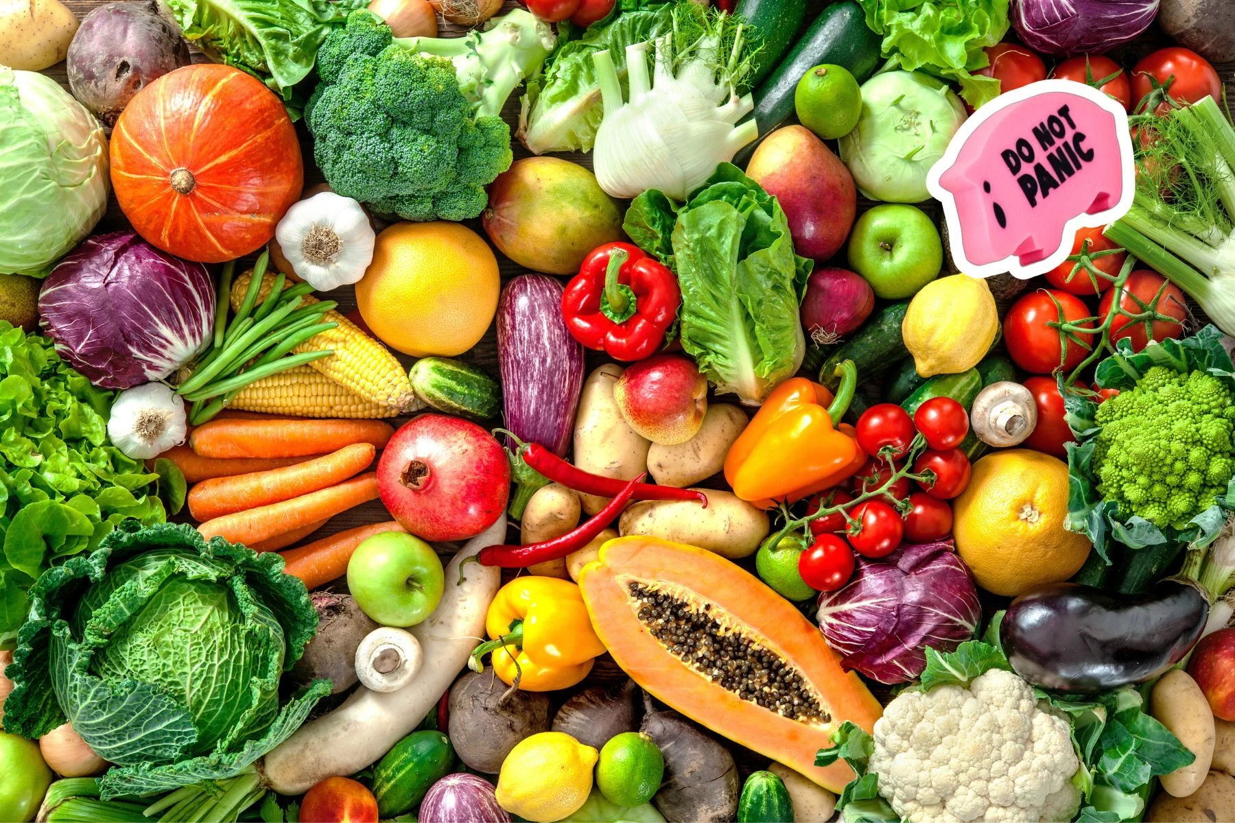 a do not panic age ham among a colorful assortment of vegetables