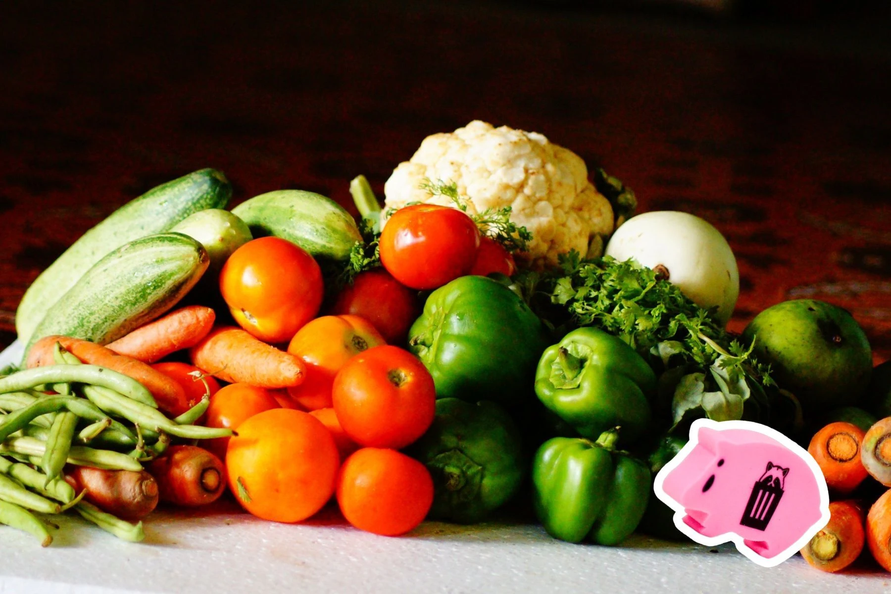 an age ham beside tomatoes, carrots, cucumber and cauliflower